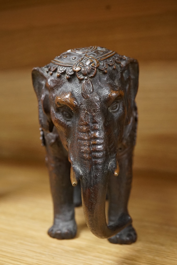 A novelty late 19th/early 20th century bronze inkwell in the form of an Indian elephant, 27cm wide